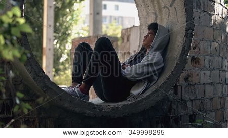 Sad Lonely Student In Hoodie Sitting Alone Abandoned Building, Puberty Isolation