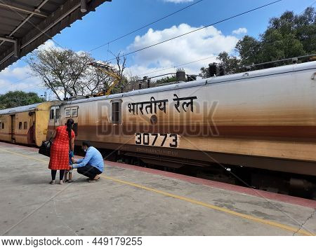 Closeup Of Mandya Railway Station And Train Moving From One Place To Another, Waiting People In The