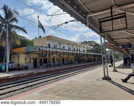 Closeup Of Mandya Railway Station And Train Moving From One Place To Another, Waiting People In The