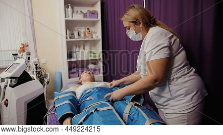 Woman Receiving Anti-cellulite Pressotherapy Lymphatic Massage Drainage Machine, Hardware Cosmetolog