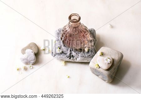 Beautiful Pink Transparent Bottle Of Perfume With Flowers