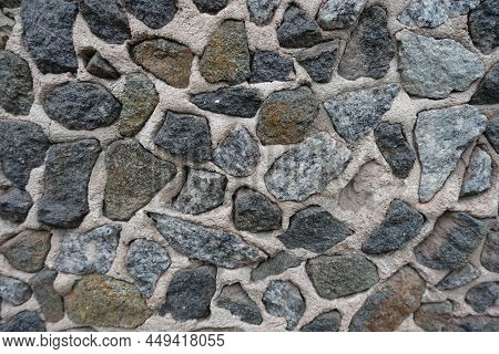 Close View Of Wall With Dark Gray Gravel Pebble Dash