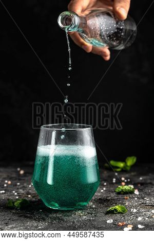 Blue Low Alcohol Drink, Chilled Colorful Beverages On Rustic Black Background. Summer Party. Alcohol