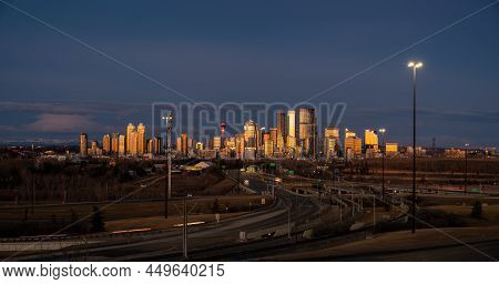 Panoramic View Of Calgary's Skyline At Sunrise.