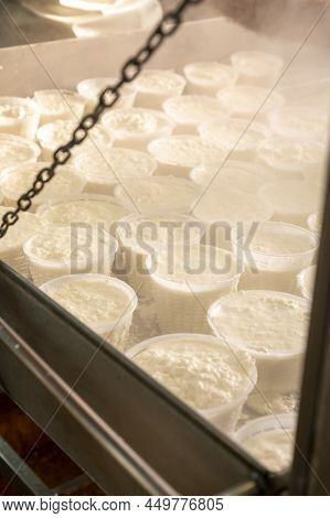 Process Of Making Fresh White Soft Ricotta Whey Cheese On Small Cheese Farm In Parma, Italy