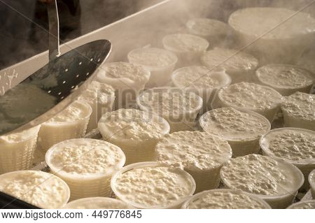 Process Of Making Fresh White Soft Ricotta Whey Cheese On Small Cheese Farm In Parma, Italy