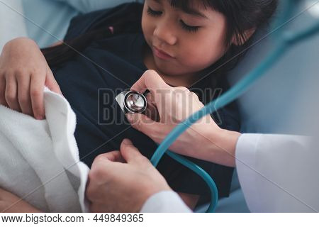 Asian Woman Pediatrician Doctor Hold Stethoscope For Exam A Little Girl Patient And Heck Heart Lungs