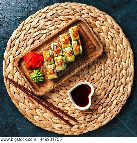 Japanese Rolls With Shrimp Wrapped In Cucumber, Sauce Sushi Top View