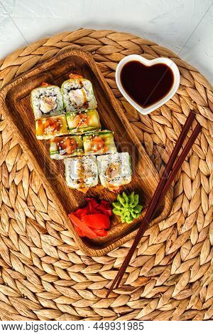 Japanese Rolls With Shrimp Wrapped In Cucumber, Sauce Sushi Top View