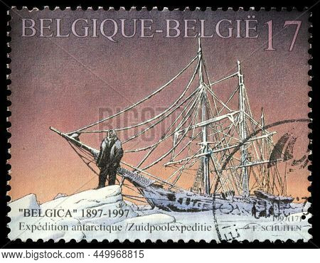 Luga, Russia - October 04, 2021: A Stamp Printed By Belgium Shows Belgica Ship Trapped In The Ice. T