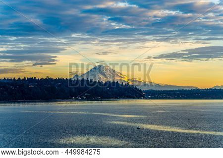 A View Ofr Mount Rainier From Burien, Washington At Sunset.