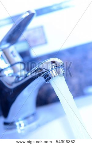 Ceramic sink with chrome fixture, close up