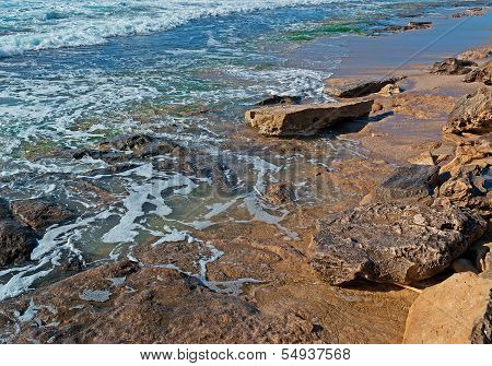 Rocks And Blue Water