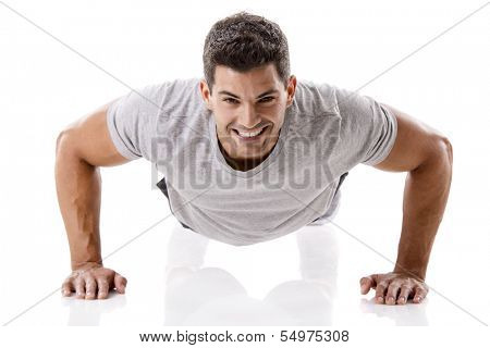 Man making pushups in studio, isolated over a white background