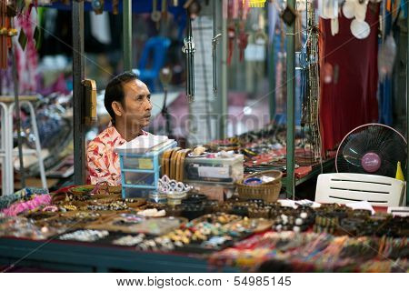 Thai salesman waiting for customers at the night market