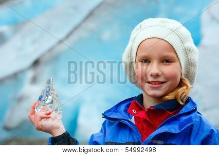 Girl With Ice Piece Near Nigardsbreen Glacier (norway)