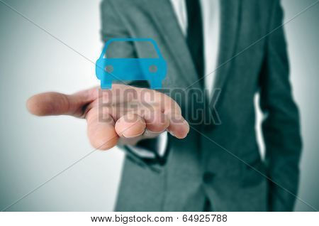 a businessman with a car icon in his hand