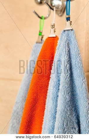 Three Towels Hanging On A Hook