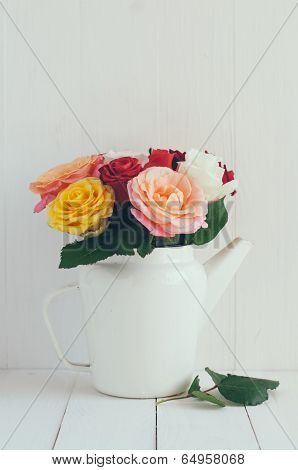 Colorful Roses In White Enamel Coffee Pot