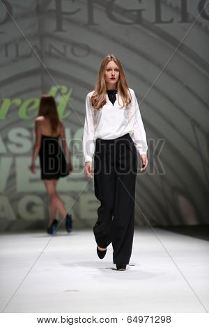 ZAGREB, CROATIA - MAY 09: Fashion model wearing clothes designed by Avaro Figlio on the Zagreb Fashion Week on May 09, 2014 in Zagreb, Croatia.