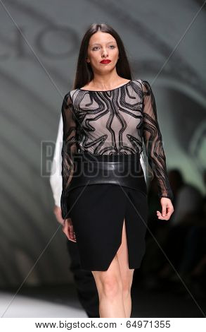 ZAGREB, CROATIA - MAY 09: Fashion model wearing clothes designed by Avaro Figlio on the Zagreb Fashion Week on May 09, 2014 in Zagreb, Croatia.