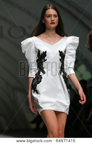 ZAGREB, CROATIA - MAY 09: Fashion model wearing clothes designed by Avaro Figlio on the Zagreb Fashion Week on May 09, 2014 in Zagreb, Croatia.