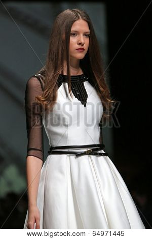 ZAGREB, CROATIA - MAY 09: Fashion model wearing clothes designed by Avaro Figlio on the Zagreb Fashion Week on May 09, 2014 in Zagreb, Croatia.