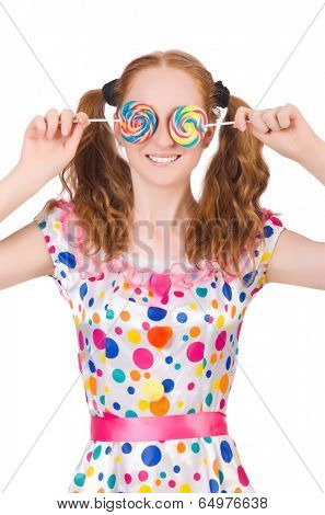 Redhead young girl with lolipops isolated on white
