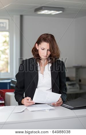 Young Businesswoman Checks Contract