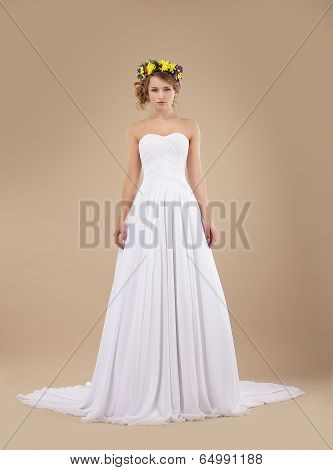 Espousal. Bride Fashion Model With Wreath Of Flowers In White Dress