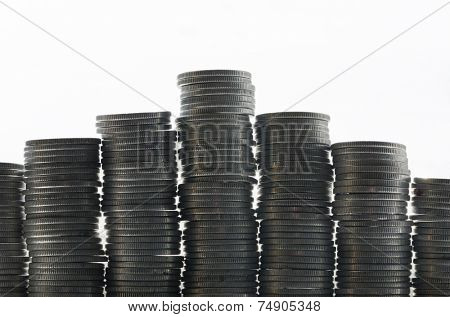 Silver coins in high stacks