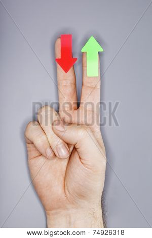 A hand with arrow stickers. Very short depth-of-field and ring flash lighting.