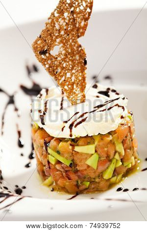 Salmon with Avocado Tartare. Topped with Cream Cheese and Crispy Bread