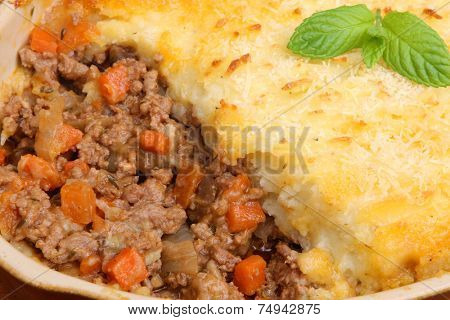 Freshly baked shepherds pie in casserole dish.