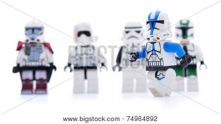 Ankara, Turkey - May 28, 2013: Lego Star Wars minifigure Sandtrooper walking infront of sandtroopers and stormtroopers isolated on white background.  