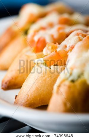 Preparing bruschetta for evening snack