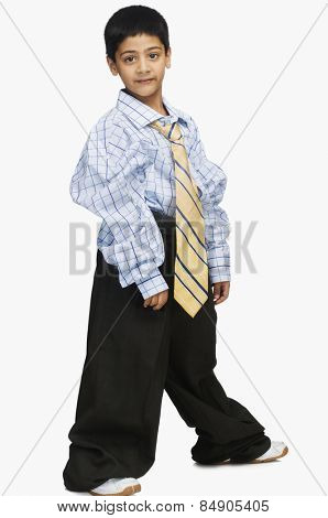 Portrait of a boy wearing oversized clothes