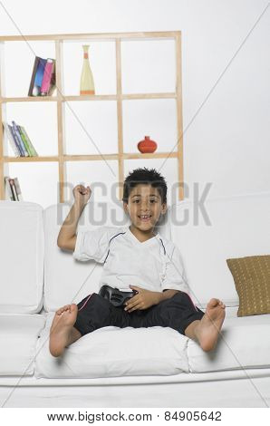 Boy playing handheld video game