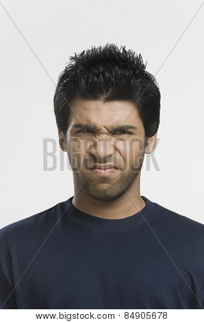Close-up of a man shrinking nose