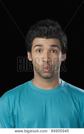 Portrait of a man puckering