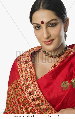 Woman in bright red mekhla