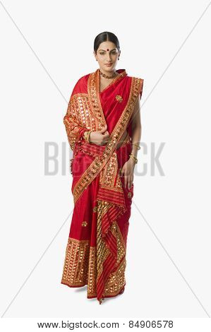 Woman in bright red mekhla