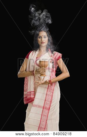 Bengali woman performing ritual dance