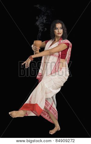 Bengali woman performing ritual dance