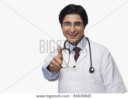 Portrait of a doctor showing thumbs up and smiling