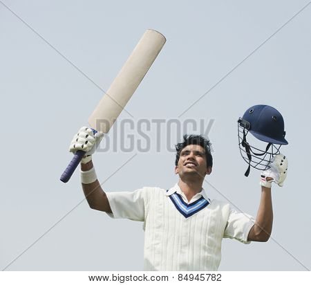 Cricket batsman celebrating his success