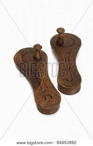 Close-up of pair of Paduka, traditional Indian wooden footwear worn by Hindu priests and Brahmins