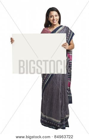 Woman holding at a whiteboard and smiling
