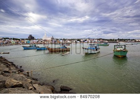 Fishing harbor with large church in background, Laccadive Sea, KanyaKumari, Tamil Nadu, India