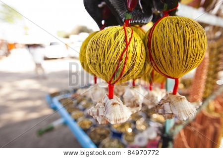 Coconuts tied up with threads at a market, Shani Shingnapur, Ahmadnagar, Maharashtra, India